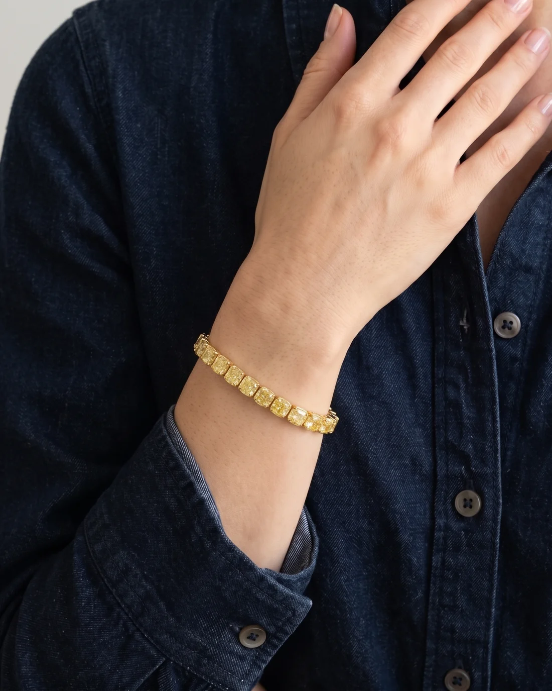 ORTIGAS Yellow Cushion Line bracelet, worn on the wrist