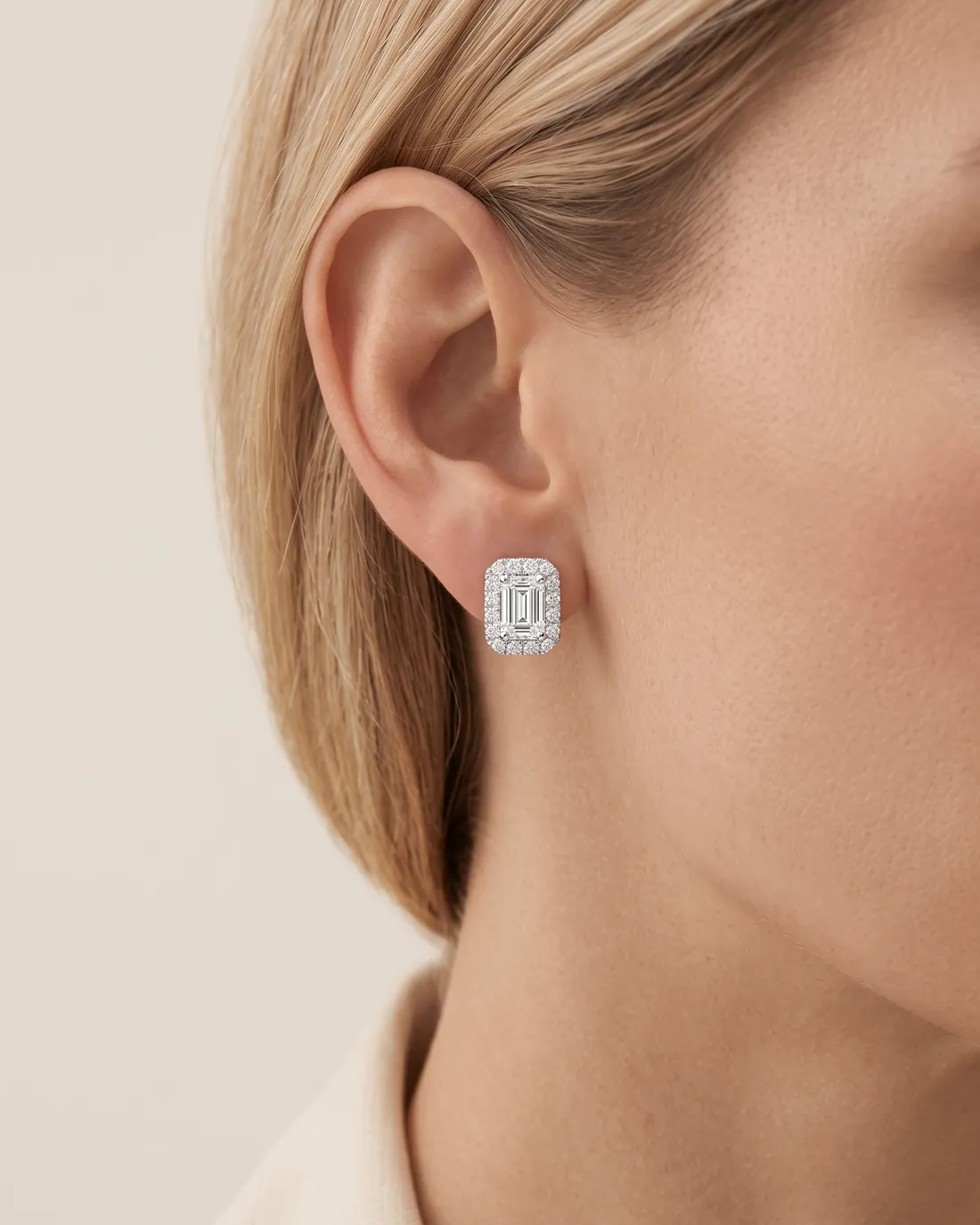ORTIGAS Emerald Halo Studs earrings, worn on the ear