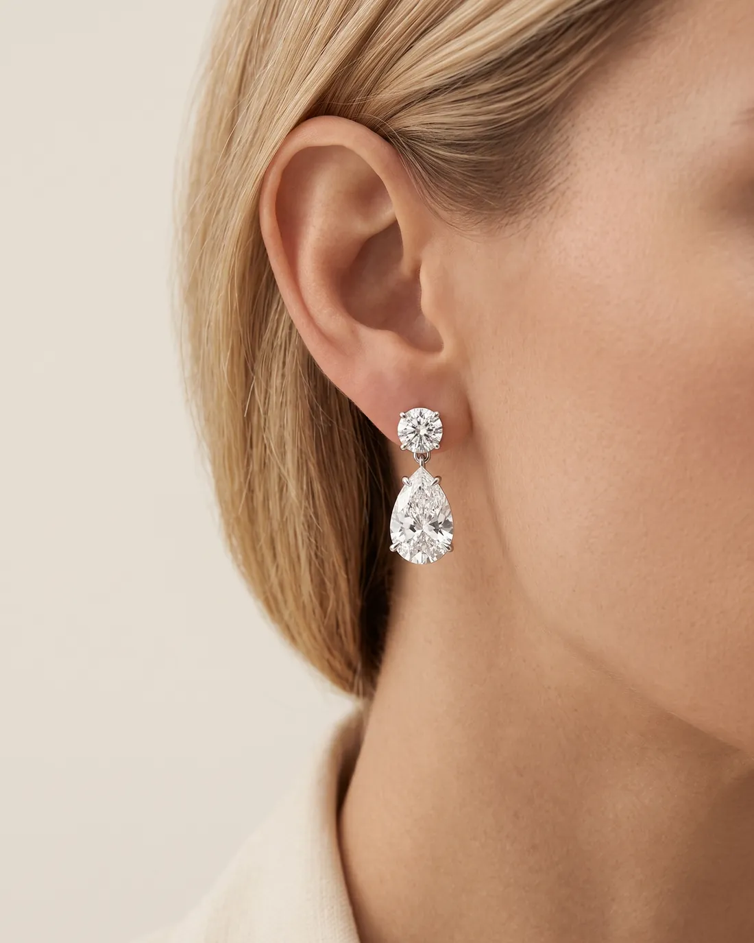 ORTIGAS Pear Drops earrings, worn on the ear