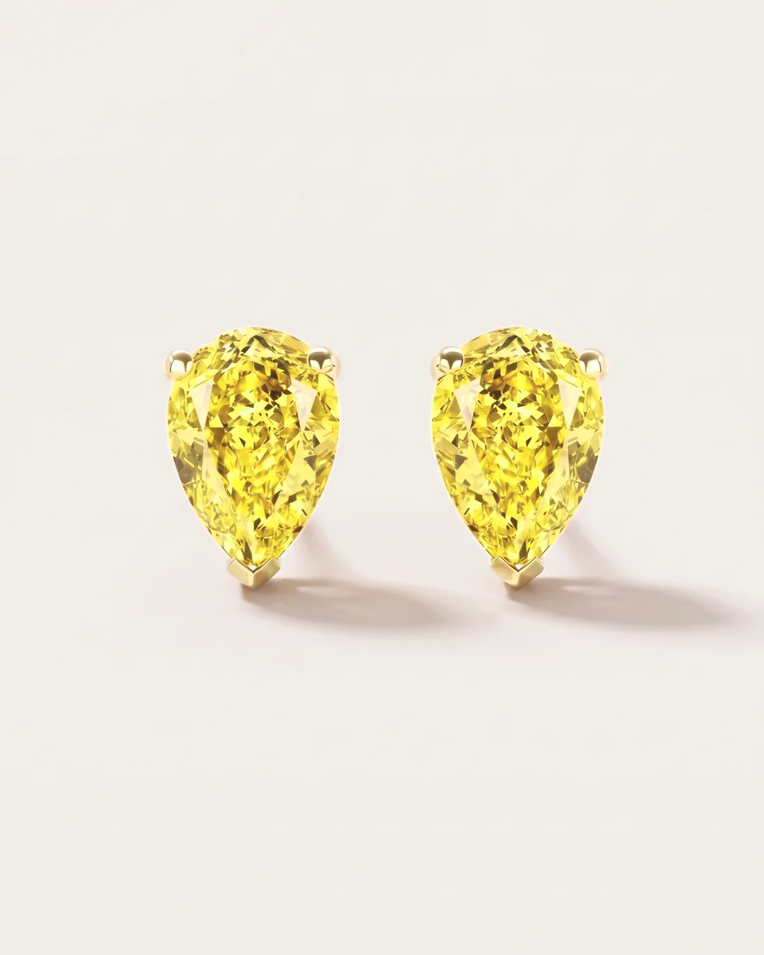 ORTIGAS Yellow Pear Studs earrings, front view