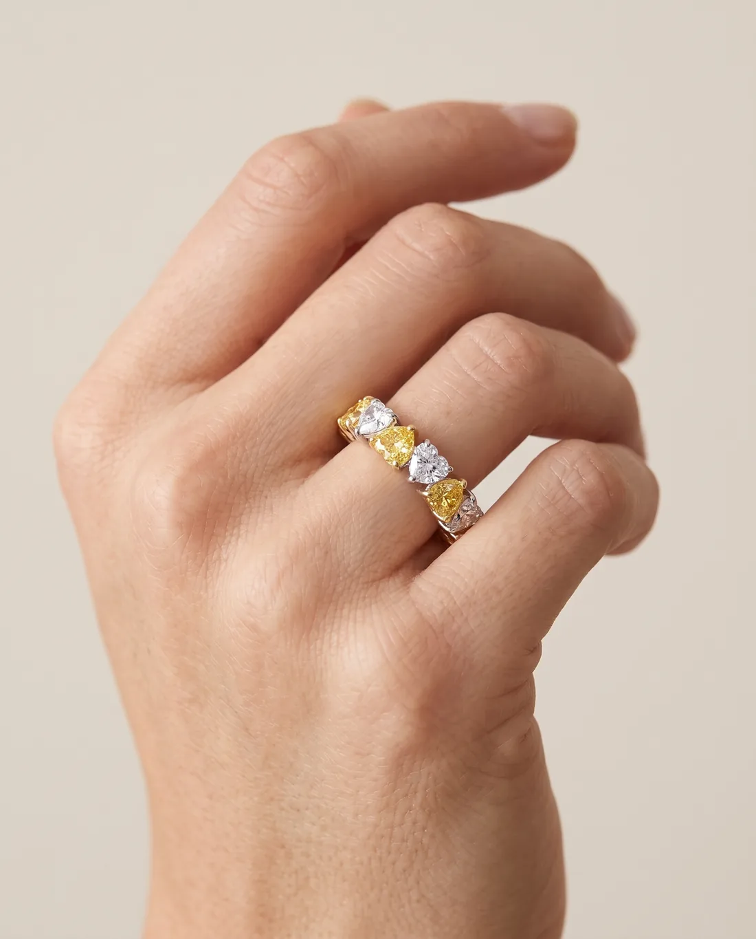 ORTIGAS Alternating Hearts ring, worn on the hand
